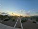 Serene walking path through desert landscape at sunset, offering tranquility and outdoor enjoyment at 853 Rusty Anchor Way, Henderson, NV 89002