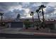 Charming single-story home featuring desert landscaping, mature palm trees, and a two-car garage at 853 Rusty Anchor Way, Henderson, NV 89002