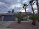 Charming single-story home featuring desert landscaping and a two-car garage with a modern front facade at 853 Rusty Anchor Way, Henderson, NV 89002