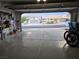 View from inside the garage, showcasing neighboring homes and the well-lit space at 853 Rusty Anchor Way, Henderson, NV 89002