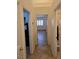 Hallway with views into other rooms including a glimpse into a bedroom and bathroom at 853 Rusty Anchor Way, Henderson, NV 89002