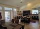 Bright kitchen with stainless steel appliances, tile floors, and casual dining space at 853 Rusty Anchor Way, Henderson, NV 89002