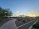 Peaceful walkway with desert landscaping, benches and a beautiful sunset sky at 853 Rusty Anchor Way, Henderson, NV 89002
