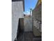 The side yard showcases a walkway with a gate leading to a backyard area, enclosed by block walls at 853 Rusty Anchor Way, Henderson, NV 89002
