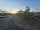 Smooth paved walking path winding through community landscaping, perfect for evening strolls and exercise at 853 Rusty Anchor Way, Henderson, NV 89002