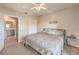 Inviting bedroom showcases a full bed, neutral colors, and access to the ensuite bathroom at 8777 W Maule Ave # 3102, Las Vegas, NV 89148