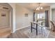 Cozy dining area with wood table, stools, and stylish decor and sliding glass doors at 8777 W Maule Ave # 3102, Las Vegas, NV 89148