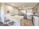 Modern kitchen featuring quartz countertops, stainless steel appliances, and island seating at 8777 W Maule Ave # 3102, Las Vegas, NV 89148