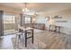 Open-plan living space with dining area, sofa, work area and outdoor patio at 8777 W Maule Ave # 3102, Las Vegas, NV 89148