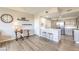 Bright living space with wood floors, work area, and access to the kitchen at 8777 W Maule Ave # 3102, Las Vegas, NV 89148