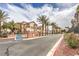 Attractive townhome community entrance with lush landscaping and a welcoming sign at 8777 W Maule Ave # 3102, Las Vegas, NV 89148
