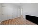 Bedroom with wood-style flooring and sliding door closet, great for storage solutions at 9121 Ripple Ridge Ave # 101, Las Vegas, NV 89149