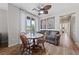 Bright dining area with wood floors, contemporary lighting, and patio access at 9121 Ripple Ridge Ave # 101, Las Vegas, NV 89149