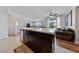 Kitchen area showcases dark wood cabinets and an open concept layout at 9121 Ripple Ridge Ave # 101, Las Vegas, NV 89149