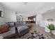 Bright living room showcases open layout leading into modern kitchen at 9121 Ripple Ridge Ave # 101, Las Vegas, NV 89149