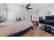 Comfortable main bedroom with a ceiling fan and ample natural light at 9121 Ripple Ridge Ave # 101, Las Vegas, NV 89149