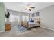 Large bedroom with natural light, ceiling fan, and a comfortable queen bed at 9144 Irish Elk Ave, Las Vegas, NV 89149