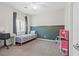 Cozy bedroom with a desk, play kitchen, and a window for natural light at 9144 Irish Elk Ave, Las Vegas, NV 89149