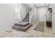 Entryway with a stairway, tile flooring, and coat rack at 9144 Irish Elk Ave, Las Vegas, NV 89149