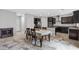 Bright kitchen with dark cabinetry and a dining area at 9144 Irish Elk Ave, Las Vegas, NV 89149