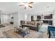 Open concept living space with a kitchen and a comfortable living area at 9144 Irish Elk Ave, Las Vegas, NV 89149