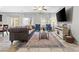 Bright living room featuring a large couch, and lots of natural light at 9144 Irish Elk Ave, Las Vegas, NV 89149