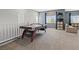 Loft area featuring an air hockey table and a couch with carpeting at 9144 Irish Elk Ave, Las Vegas, NV 89149