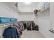 Bright walk-in closet with ample storage and shelving units for clothes at 9144 Irish Elk Ave, Las Vegas, NV 89149