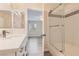 Stylish bathroom showcasing a vanity, mirror, and glass-enclosed shower at 950 Seven Hills Dr # 424, Henderson, NV 89052