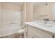 Clean bathroom with a tub, vanity, quartz countertop, and a modern faucet at 950 Seven Hills Dr # 424, Henderson, NV 89052