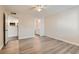 Open bedroom area with wood-look flooring, connected to kitchen and bathroom at 950 Seven Hills Dr # 424, Henderson, NV 89052