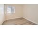Bedroom with wood-look flooring and a window providing natural light at 950 Seven Hills Dr # 424, Henderson, NV 89052