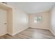 Well-lit bedroom with wood-look flooring and natural light from the window at 950 Seven Hills Dr # 424, Henderson, NV 89052