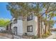 Exterior view of the condo building with mature trees and landscaping at 950 Seven Hills Dr # 424, Henderson, NV 89052