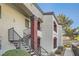 Exterior of a two-story condo building with staircase access to upper units at 950 Seven Hills Dr # 424, Henderson, NV 89052