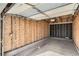 Inside a detached garage, featuring exposed wood frame, offering potential for customization and storage at 950 Seven Hills Dr # 424, Henderson, NV 89052