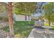 Outdoor grilling area with built-in grill and seating, ideal for entertaining amidst landscaped grounds at 950 Seven Hills Dr # 424, Henderson, NV 89052