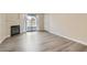 Open living room with luxury vinyl plank flooring, fireplace, and balcony access at 950 Seven Hills Dr # 424, Henderson, NV 89052