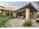 This beautiful back patio includes outdoor seating, a built-in grill, and easy access to the home's interior at 9889 Gemstone Sunset Ave, Las Vegas, NV 89148