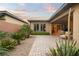 The back patio features desert landscaping, privacy walls and a beautiful pavers for a low maintenance outdoor space at 9889 Gemstone Sunset Ave, Las Vegas, NV 89148