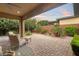 Charming patio with lush garden, perfect for outdoor relaxation and entertaining at 9889 Gemstone Sunset Ave, Las Vegas, NV 89148