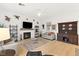 Comfortable living room with a fireplace, modern decor, and hardwood floors at 9889 Gemstone Sunset Ave, Las Vegas, NV 89148
