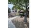 Inviting two-story home with a well-maintained yard, mature tree, and partially-enclosed front patio at , Las Vegas, NV 89102