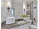 Bright bathroom featuring granite counters, modern fixtures, and a shower-tub combination at 10004 W Cherokee Ave, Las Vegas, NV 89147