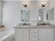 Bright bathroom featuring double sinks, granite countertop and modern fixtures at 10004 W Cherokee Ave, Las Vegas, NV 89147