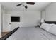 Cozy bedroom with a queen-size bed, and a mounted TV, for convenient entertainment at 10004 W Cherokee Ave, Las Vegas, NV 89147