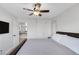 Bedroom featuring a ceiling fan, closet, and a queen-size bed with a leather headboard at 10004 W Cherokee Ave, Las Vegas, NV 89147