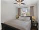 Comfortable bedroom featuring a queen-size bed, ceiling fan, and natural light from the window at 10004 W Cherokee Ave, Las Vegas, NV 89147