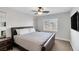 Bedroom with a ceiling fan and a queen-size bed with a leather headboard at 10004 W Cherokee Ave, Las Vegas, NV 89147