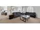Bright and open living area featuring stylish sofas and modern coffee tables for comfortable seating at 10004 W Cherokee Ave, Las Vegas, NV 89147